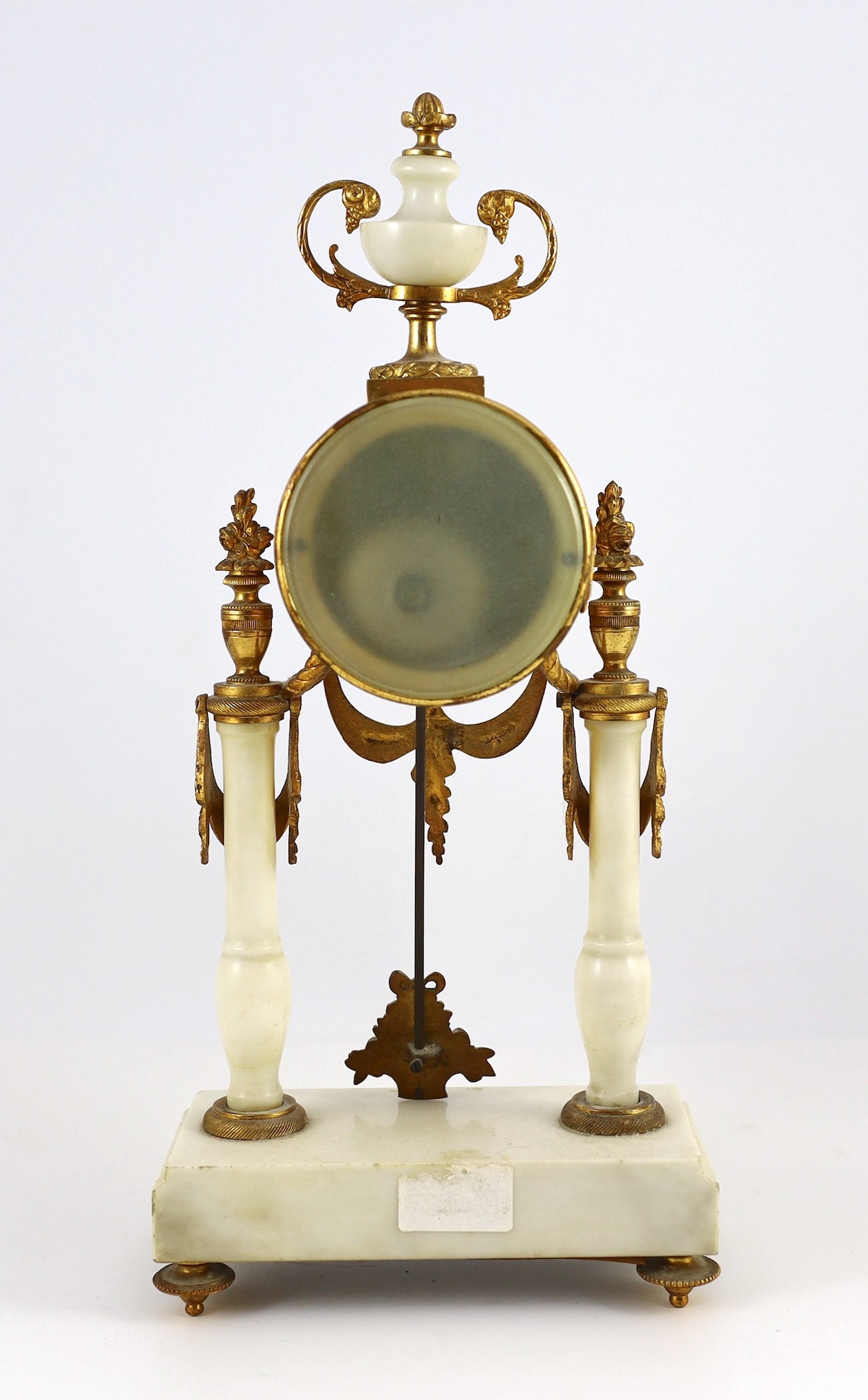 A Louis XVI style ormolu mounted white marble eight day mantel clock and a matching pair of twin branch candelabra. 38.5cm tall